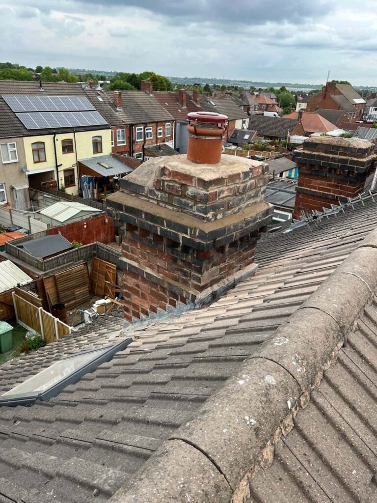 This is a photo taken from a roof which is being repaired by Dartford Roofing Repairs, it shows a street of houses, and their roofs